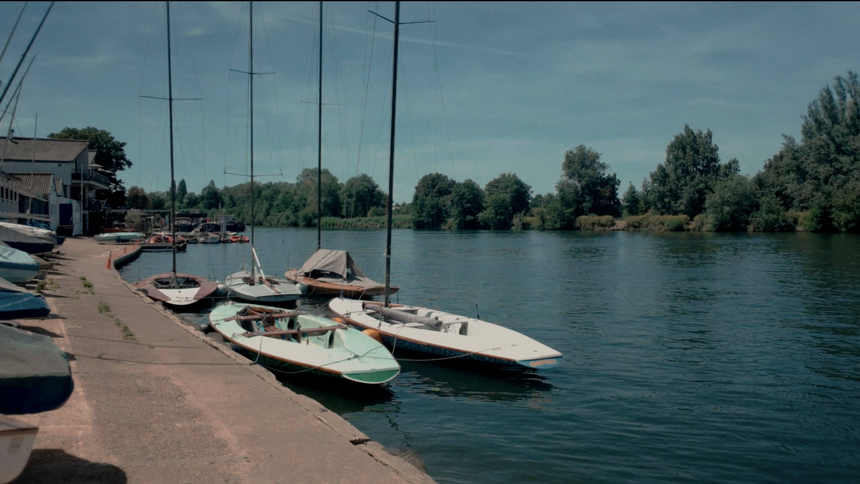 The same marina frame graded with Aura